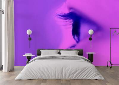 vertical eye closeup on purple neon light Wall mural