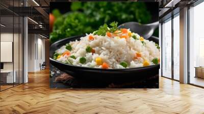 cooked rice porridge served with herbs and vegetables on a black plate with spoon Wall mural