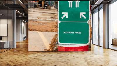 Assembly Point signage with construction site background Wall mural