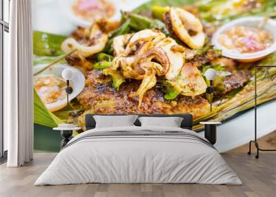 Closeup of grilled stingray fish fillet with spices, popular Malaysia delicacy. Wall mural