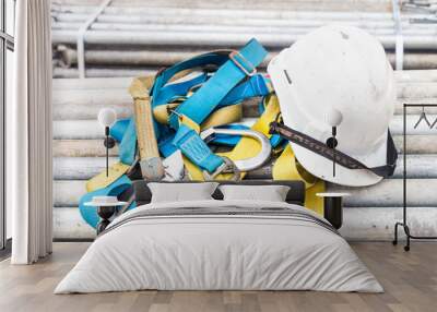 Safety helmet and harness at a construction site Wall mural