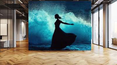 A graceful silhouette of a woman dancing near crashing waves, embodying freedom and the beauty of nature at twilight. Wall mural