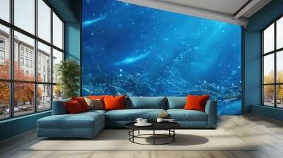 A serene underwater scene showcasing glowing fish amidst a vibrant blue backdrop, evoking a sense of tranquility and beauty. Wall mural