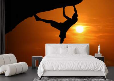 Free climbing on the mountain at red sky sunset background Wall mural