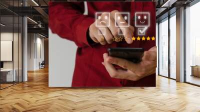 Close up on Customer Man Hand press on smartphone screen with gold five star comment icon and excellent press level for best rating in business idea service review. Wall mural