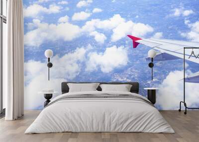 Aerial view from airplane window with sky clouds Wall mural