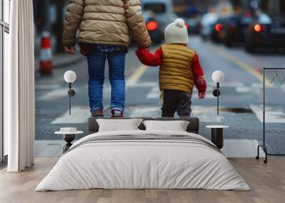 Adult helping a toddler cross a busy urban street safely Wall mural