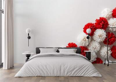 Bright red and white pompoms against a simple, clean background, adding a playful, cheerful touch with plenty of space for Canada Day messages Wall mural