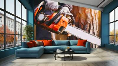 Worker Using Chainsaw for Cutting Tree Branches with Safety Gear. A worker in protective gear safely operates a chainsaw to trim trees. Wall mural