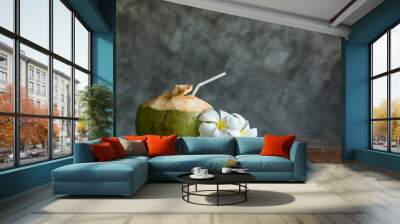 Coconut with Frangipani on the wood table over the dark backgrou Wall mural