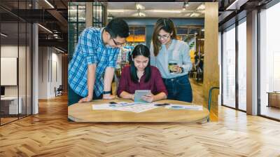 Group Of Business people with casual suit Meeting in looking at the tablet action In the modern coffee shop, closeup at finger, business group concept Wall mural