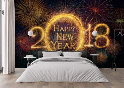 Happy new year 2018 written with Sparkle firework on fireworks with dark background, celebration and greeting cards concept Wall mural