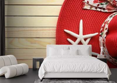 Summer straw hat and starfish on wooden background Wall mural