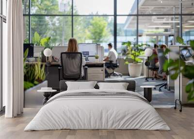 A large open office space with many desks and plants Wall mural