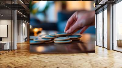 Hand Arranging Coasters on a Minimalist Coffee Table Wall mural