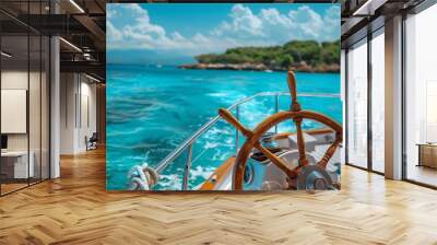 Nautical scene with a boat steering wheel and the breathtaking clear blue sea in the background Wall mural