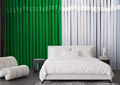 top view of white and green plastic drinking  straws in a row Wall mural