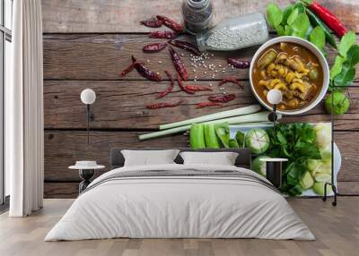 On the table with Gaeng Tai Pla and vegetables. Wall mural