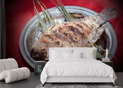 Grilled fish on charcoal stove. Wall mural