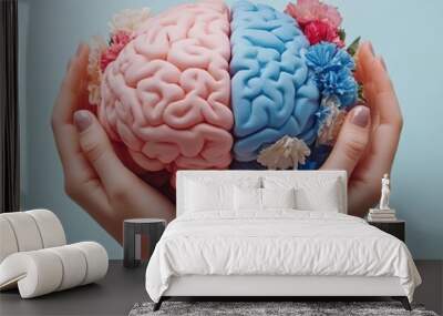 A conceptual image showcasing a split brain model, representing creativity and logic, held by hands against a soft background. Wall mural