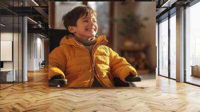 A happy boy in a wheelchair, wearing a bright yellow jacket, enjoying a sunny day indoors with a warm smile. Wall mural