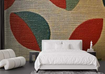 Colorful fabric pattern with red and green leaf shapes on a textured beige background. Wall mural