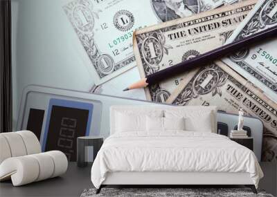 Calculator with american dollars on the wooden table background, finance concept Wall mural