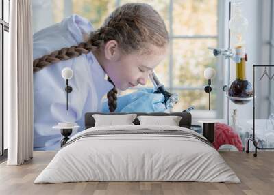 girl in high school students using microscopes in laboratory Wall mural