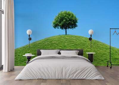 Isolated tree sits atop perfectly green hill under a cloudless blue sky, minimalist and bright landscape captures sense freedom and simplicity, with the vivid colors standing out. Wall mural