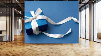 Blue gift box with white bow ribbon, mockup Wall mural