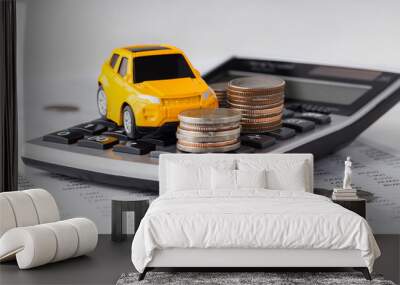 Car and coins on calculator Wall mural