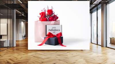 Happy valentine's day card with black gift box and rose bouquet in paper bag isolated on white background Wall mural