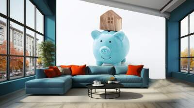 House model on piggy bank on white background Wall mural