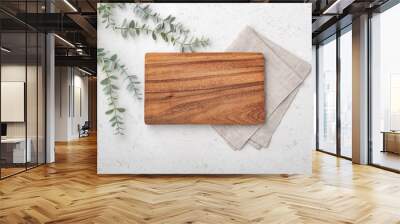 Wood cutting board with linen napkin and plant Wall mural