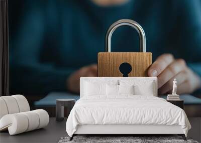 A hand reaching towards a secure digital lock hovering over an insurance document on a minimalist office desk. Minimalistic, peaceful. Realistic, close-up shot with room for text. Wall mural