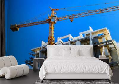 apartments construction site with yellow crane Wall mural