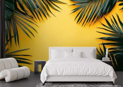 Close-up of tropical palm leaves creating a natural frame against a vibrant yellow background, emphasizing the contrast of colors and textures Wall mural