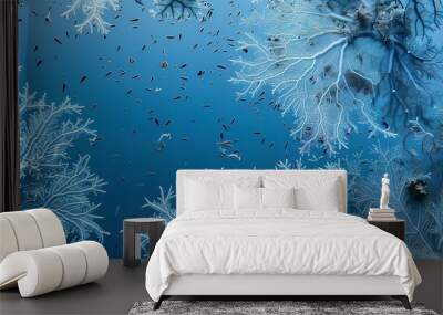 Clusters of blue star coral, detailed textures visible, surrounded by small fish, soft blue water.  Wall mural