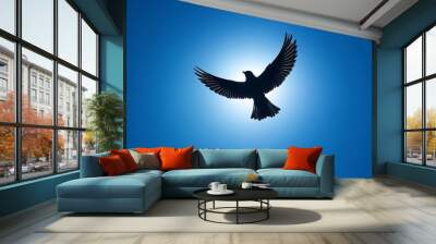 Silhouette of a bird's shadow soaring across a bright blue sky, symbolizing freedom and the ethereal beauty of flight in the natural world. Wall mural