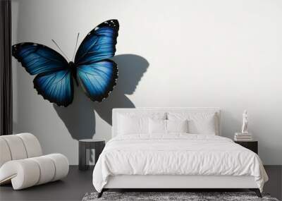 Two blue butterflies fly side by side against a pristine white backdrop A single blue butterfly's cast shadow graces the left side A solitary blue butterfly Wall mural