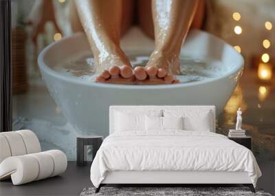 Woman, soaking feet in warm water in white basin, home background Wall mural