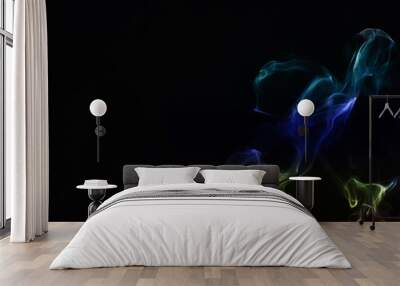 Color smoke on black background. Wall mural