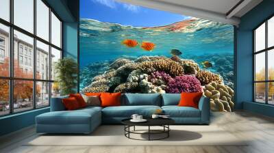 A vibrant coral reef teeming with fish, beneath the clear waters of a tropical ocean Wall mural