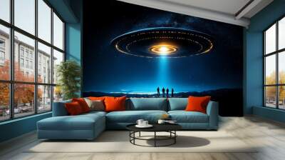 Silhouetted figures beneath a large UFO with a bright beam of light, set against a starry night sky. Wall mural