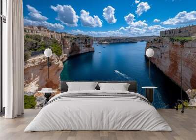 Valletta's ancient fortifications, with steep walls rising above the sea, and a view of the surrounding islands Wall mural