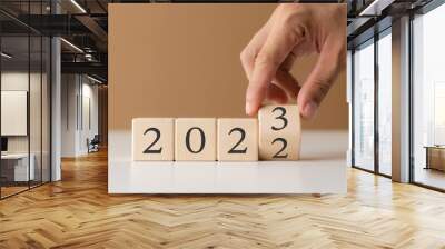 2023 new year goal planning idea, wood block cube with new year 2023 and target icon, business vision. Wall mural