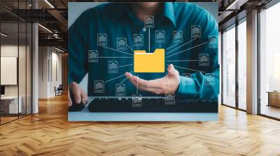 Document management system concept, business man holding folder and document icon software, searching and managing files online document database, for efficient archiving and company data. Wall mural