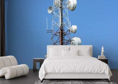 Microwave system.Wireless Communication Antenna With bright sky.Telecommunication tower with antennas with blue sky. Wall mural