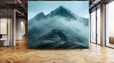 a time lapse of clouds swiftly flowing over a majestic mountain peak showcasing the dynamic and capt Wall mural