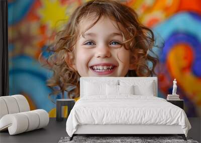 Cheerful Child Smiling Playfully Against Vibrant Backdrop Wall mural